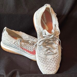 Nike Pink and White Athletic Shoes with Breathable Design